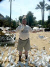 Joe Feeding White Pigeons in Seville